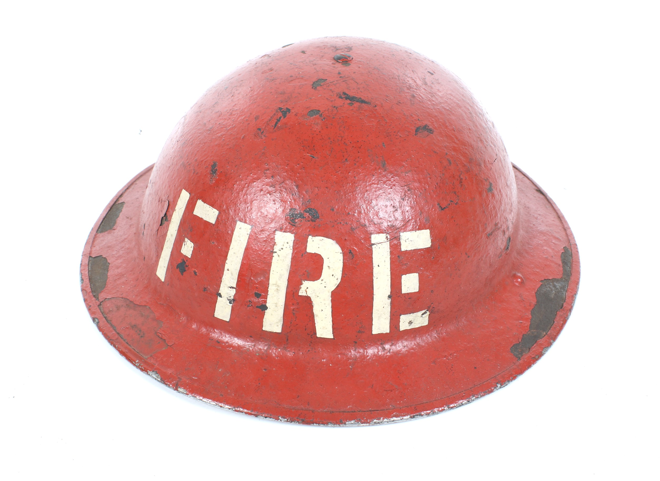 A WWII Civil Defence red Fire Service Helmet. Marked 'Fire' on front.