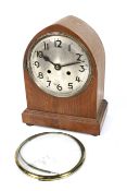 Early 20th century lancet shaped oak cased 8 day mantel clock.