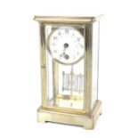 A small four glass brass cased mantel clock. A white dial with floral swags, Arabic numerals.