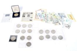 An assortment of coins and bank notes.