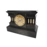 A vintage Ansonia USA black painted metal cased clock. Striking to a gong.