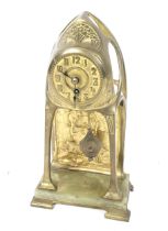 A Continental Art Nouveau brass cased portico mantel clock.