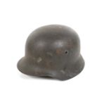 A WWII German M40 pattern helmet. SS Sturm Fritz Grasse painted inside, marked size 56 on liner.