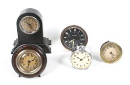 A collection of five assorted small clocks. Including a Baby Ben alarm clock, etc. Max.