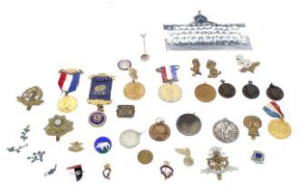 Collection of WWI and WWII cap badges buttons medals