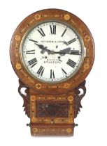 An inlaid wood cased pendulum wall clock by Fattorini & Sons, Bradford.