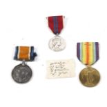 A collection of three WWI medals.