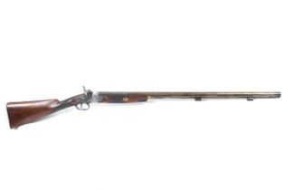 A circa 1860 English single barrel muzzle loading shotgun.