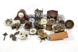 A collection of assorted vintage clock mechanisms. Including alarm clocks, movements, cases, etc.
