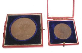 Two bronze Victoria medallions.