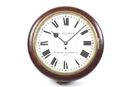 A vintage 'school' pendulum wall clock W Elliott. Mahogany case with Roman numerals.
