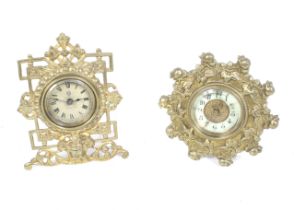Two Victorian brass cased desk timepiece. Both with British United Clock Co.