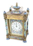 A French 8 day striking brass and cloisonne mantel clock.