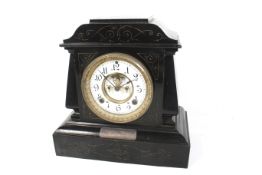 A 19th century eight day black cased metal mantel clock. With an Ansonia USA movement.