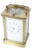 A French 19th century repeater brass carriage clock. With a white enamel dial inscribed 'Hall & Co.