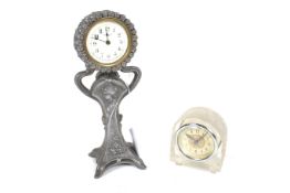 Two assorted small mantel clocks.
