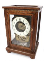 A pendulum mantel clock with a fusee chain drive. In a later glass and oak case.