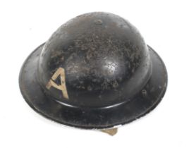 A WWII Civil Defence Helmet.