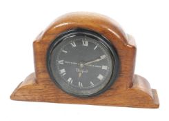 A vintage North & Sons Ltd mechanical car timepiece.