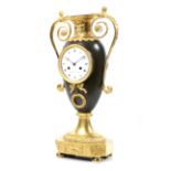 'Schuller a Paris', a circa 1810 Empire urn shaped ormolu and bronze 8 day clock.