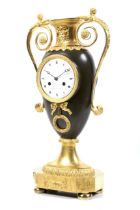'Schuller a Paris', a circa 1810 Empire urn shaped ormolu and bronze 8 day clock.