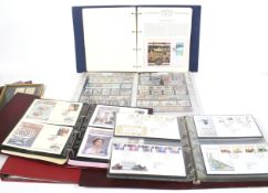A collection of first day covers and commemorative stamps.
