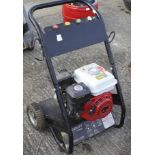 A Power Kraft petrol pressure washer.