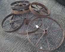 Three pairs of assorted vintage metal trolley wheels.