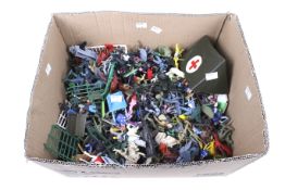 An assortment of plastic toy figures. Including farm animals, soldiers, vehicles, etc.