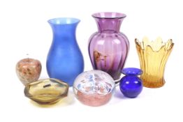 A collection of assorted coloured glassware. Including a Dartington purple glass vase, H23cm, etc.