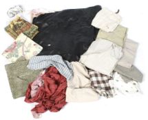 An assortment of fabric off cuts. Including cotton, patterned fabric, etc.
