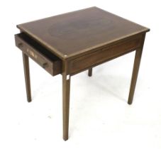 An Edwardian mahogany side table.