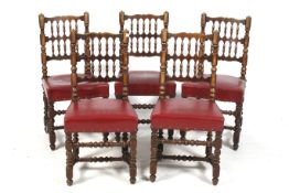 A set of five wooden chairs.