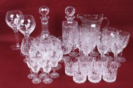 A collection of contemporary cut glassware. Including two decanters, wine glasses, a beaker, etc.