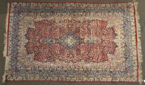 A 20th century Persian style rug.