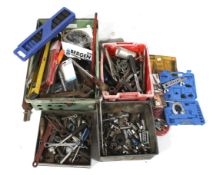 A large assortment of hand tools. Including screwdrivers, wrenches, chains, etc.