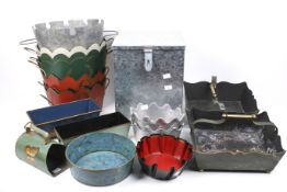 An assortment of contemporary tin ware items. Including trays, dishes, etc.