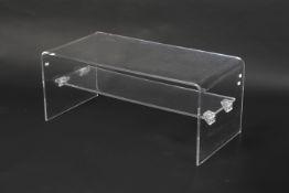 A contemporary two tier perspex coffee table.
