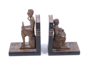 A vintage pair of carved wooden bookends. In the shape of Don Quixote and Sancho Panza.