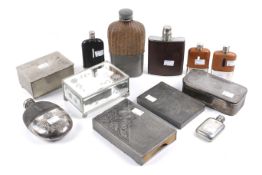 A quantity of assorted hipflasks and cigarette boxes.