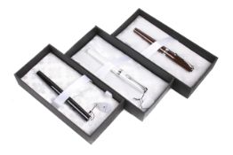 Three assorted colour Diplomat Excellence fountain pens. Cased and boxed.
