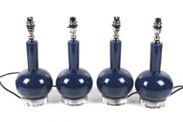 India Jane Altea, a set of four contemporary blue glass table lamps.