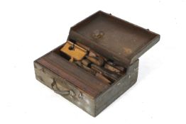 A vintage wooden toolbox and contents.