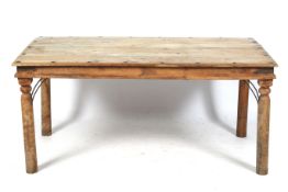 A hardwood plank top dining table.