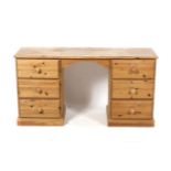 A pine twin pedestal dressing table. With three drawers either side.