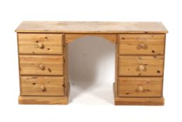 A pine twin pedestal dressing table. With three drawers either side.