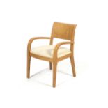 A contemporary Dwell bentwood open armchair.