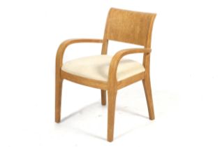 A contemporary Dwell bentwood open armchair.