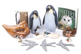 An assortment of bird ornaments.