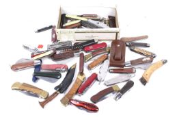 A large collection of vintage pocket and pen knives. In two boxes.